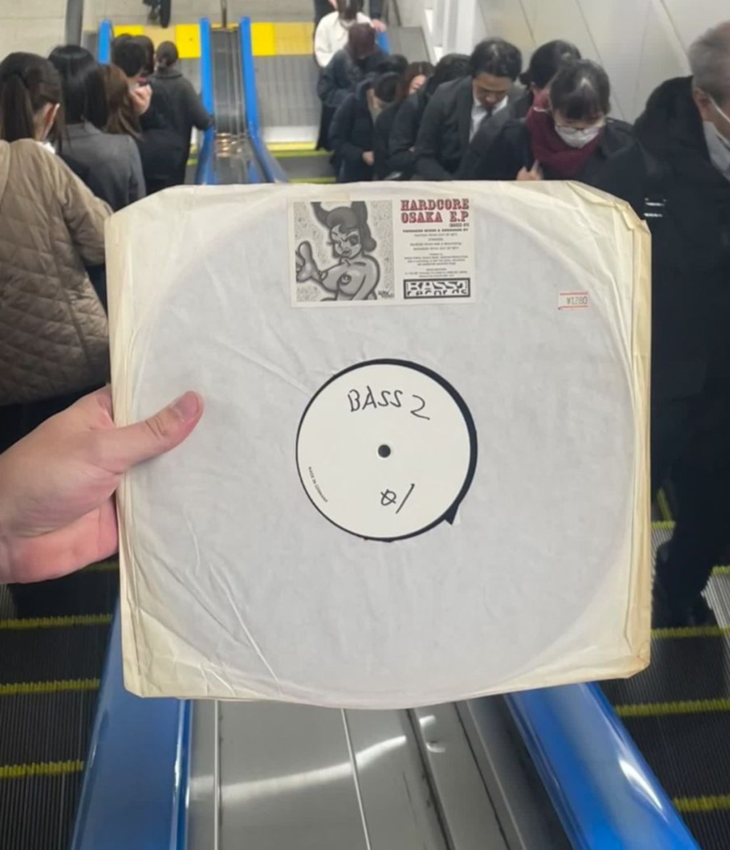 Picture of vinyl record "Hardcore Osaka" on an escalator in Tokyo